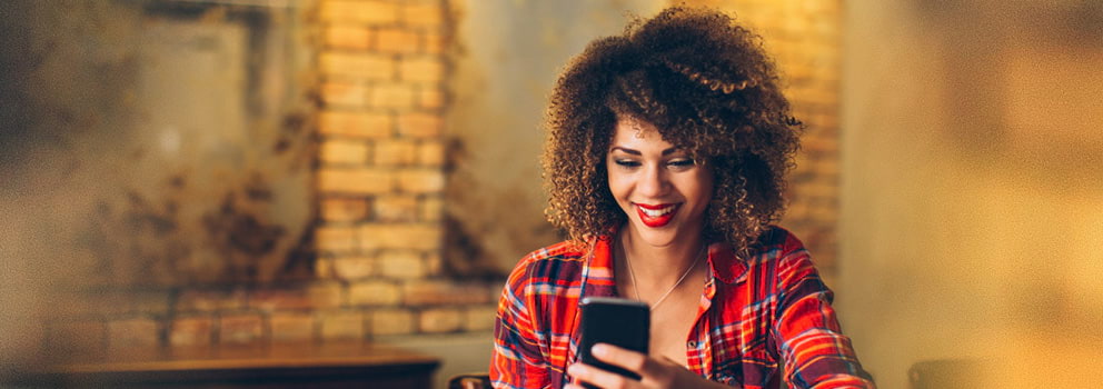 Light Commerce woman using mobile phone